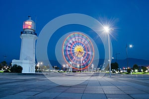 Night view of ferris wheel and old lighthouse,Batumi,Georgia