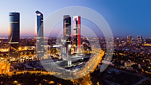 Night view of the four towers of the business district in Madrid. photo