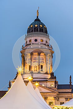 Night view of French Cathedral and Christmas market in the Gendarmenmarkt Berlin, Germany, the church erected for French Huguenots