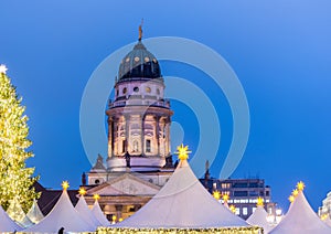 Night view of French Cathedral and Christmas market in the Gendarmenmarkt Berlin, Germany, the church erected for French Huguenots