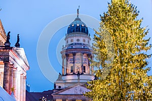 Night view of French Cathedral and Christmas market in the Gendarmenmarkt Berlin, Germany, the church erected for French Huguenots