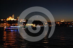 Night view of the Galata Bridge, in Istanbul (Turkey). Golden horn. Fishers