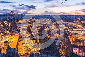 Night view of Goreme town with cave hotel built in rock formation in national park Goreme, Cappadocia, Turkey