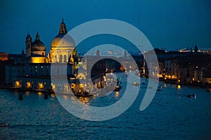 Night view of Grand Canal and basilica di santa maria della salute in Venice, Italy