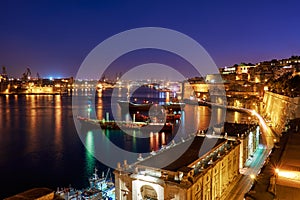 The night view of Grand Harbour with the cargo ships moored near