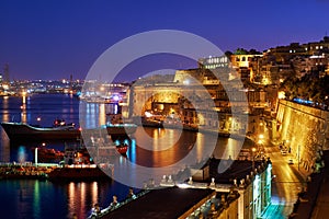 The night view of Grand Harbour with the cargo ships moored near