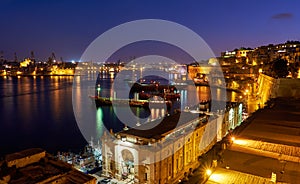 The night view of Grand Harbour with the cargo ships moored near