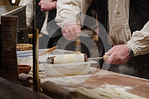 Night view at hand make TrdelnÃ­ks on wooden table at front of stall in  Weihnachtsmarkt, Christmas Market Christmas Market..