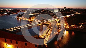 Night view of the historic city of Porto, Portugal with the Dom Luiz bridge