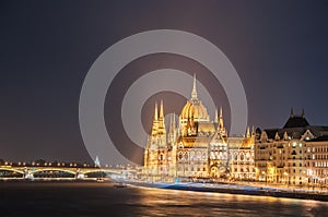 Night view of the Hungarian Parliament Building on the bank of the Danube in Budapest