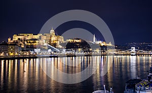 Night view of illuminated Budapest with Danube river, palace and bridge.