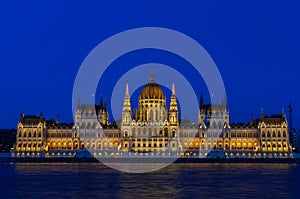 Night view of the illuminated building of the Hungarian Parliament in Budapest.