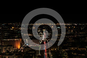 Night view of the illuminated city, the trails of car lights cut