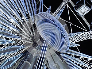 Night view of the illuminated ferris wheel on Place de la Concorde in Paris