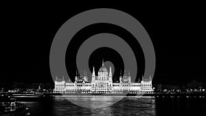 Night view of illuminated Parliament building in Budapest, Hungary. Black and white