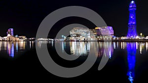 Night view of the illuminated port of Barcelona. Timelapse. Loop