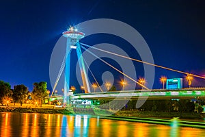 Night view of the illuminated SNP bridge over Danube in Bratislava...IMAGE