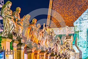 night view of illuminated statues of apostles in front of the saint peter and paul church in Krakow/Cracow, Poland