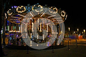 Night view of the illuminated vintage carousel