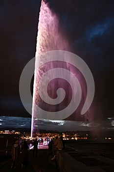 Night view of the Jet d\'Eau, a large fountain in Geneva, Switzerland and is one of the city