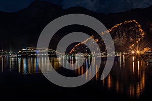 Night view of Kotor Fortress wall with heart-shape reflection