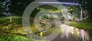 Night view of Liberty bridge and waterfalls in Greenville Falls park