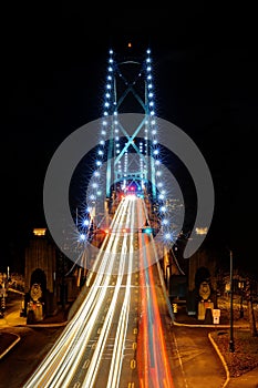 Night View of Lions Gate Bridge with car light trails