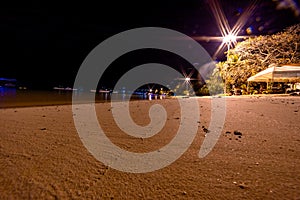 Night view of Loh Dalum Beach in Phi Phi Islands, Thailand. Sea and lights