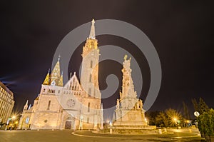 Night view of the Matthias Church and Statue of Holy Trinity, Budapest, Hungary