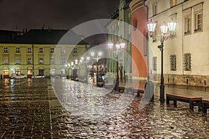 Night view medieval buildings near main market Square Krakow, Poland photo