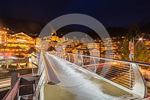 Night view of modern bridge to mountain village