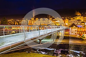 Night view of modern bridge to mountain village