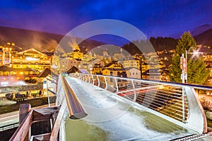 Night view of modern bridge to mountain village