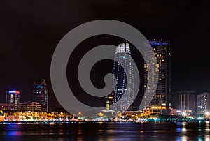 Night view of modern buildings and Han River in Danang city