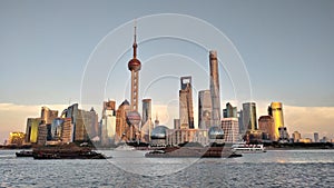 Night view of the modern Pudong skyline across the Bund in Shanghai, China. Shanghai is the largest Chinese city