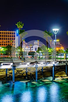 Night view of Molos promenade with several piers leading to the mediterranean sea in Limassol, Cyprus