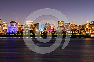 Night view of the Montreal city skyline, city hall with St Lawrence river