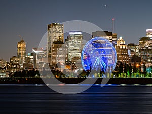 Night view of the Montreal city skyline with St Lawrence river