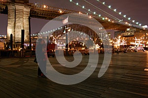 Night view of the most emblematic buildings and skyscrapers of Manhattan (New York). Brooklyn bridge. River Hudson. photo