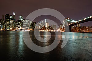 Night view of the most emblematic buildings and skyscrapers of Manhattan (New York). Brooklyn bridge. River Hudson. photo