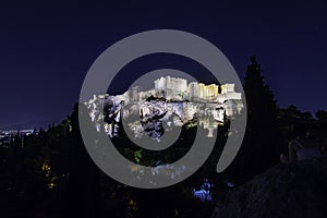 Night view from Mount Areopagus from the main entrance to the Acropolis illuminated at nightfall, Athens, Greece