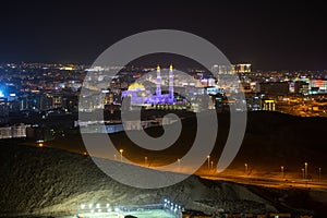 Night view of Muscat city and Muhammed Al Ameen Mosque. Sultanate of Oman