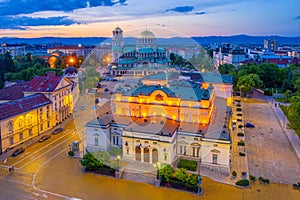 Night view of the National Assembly of the Republic of Bulgaria and Alexander Nevski cathedral in Sofia. Sign translates - Unity