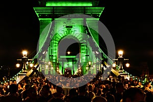 night view of the newly renovated chain bridge over the Danube river in Budapest.