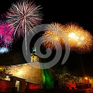 Night view of Nitra castle from below with evening skyline during new years fireworks