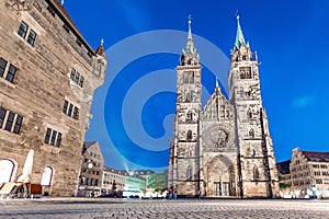 night view in Nuremberg on the illuminated building of the Church of St. Lorenz . Travel and sightseeing in Germany