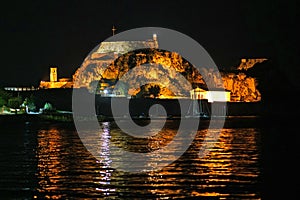 Night view of the old fortress seen from the bay of Garitsa in Corfu