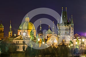 Night view of  Old Town Bridge Tower and background of  Church of St Francis Seraph at the bank of River Vltava, view from the