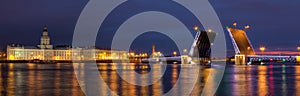 Night view on open Palace Bridge and Neva River