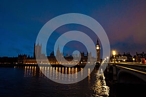Night view of the Palace of Westminster and Big Ben on the north bank of the River Thames